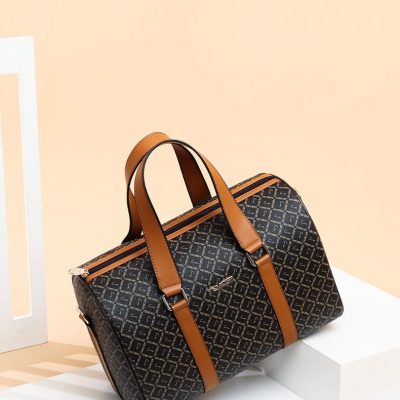 Luxury designer travel bag with monogram pattern, durable leather accents, and spacious interior perfect for stylish trips. Elegant accessories for fashion-conscious travelers.