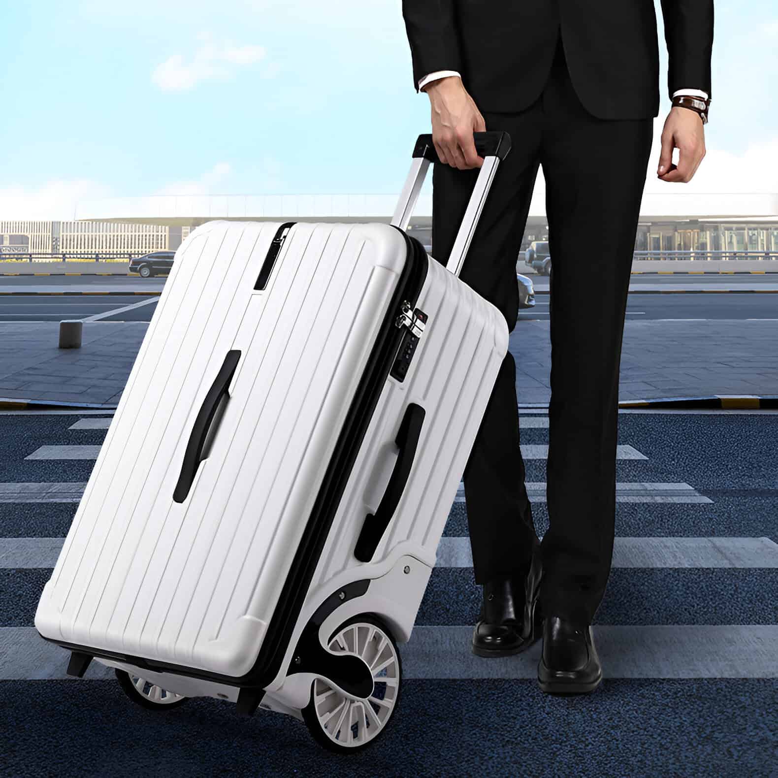 Light gray hard-shell suitcase with black handles on city street, man in formal suit holding extendable luggage handle, ready for travel, modern travel accessories, airport transportation.