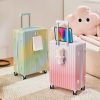 Pastel-colored hard shell suitcases with telescoping handles and wheels, suitable for travel, displayed indoors at Monalisa Store.
