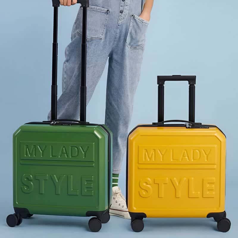 Green and yellow fashion-forward luggage with "MY LADY STYLE" embossed, ideal for travel accessories and stylish suitcases for women, modern design, portability, snapping wheels, trendy and practical travel gear.