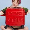 Stylish woman with red suitcase featuring "MY LADY STYLE" text, casual fashion, travel and luggage, smiling traveler, vibrant accessories, fashion accessories, modern travel gear, cheerful mood, trendy luggage, young traveler, fashion-forward travel, Monalisa Medical store keyword relevance.