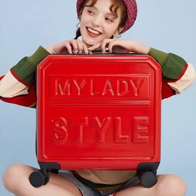 Stylish woman with red suitcase featuring "MY LADY STYLE" text, casual fashion, travel and luggage, smiling traveler, vibrant accessories, fashion accessories, modern travel gear, cheerful mood, trendy luggage, young traveler, fashion-forward travel, Monalisa Medical store keyword relevance.