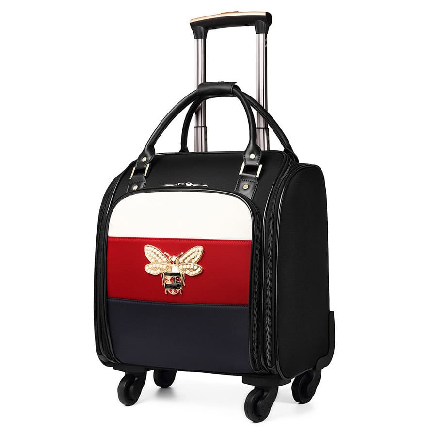 Elegant designer rolling travel bag with a butterfly embellishment, perfect for luxury travel and optical accessories, featuring durable wheels and adjustable handle for convenience.