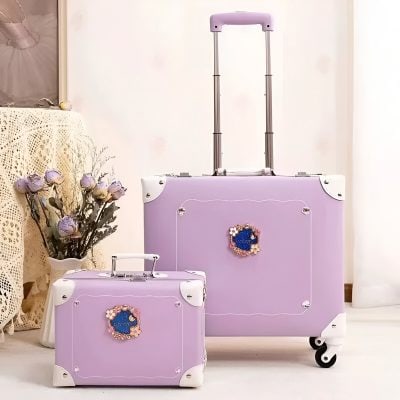 Pink travel cosmetic cases with decorative flower accents, perfect for beauty and skincare essentials.