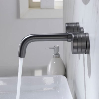 Faucet with running water in a modern medical or dental clinic setting, stainless steel design, clean and hygienic environment for health-related services.