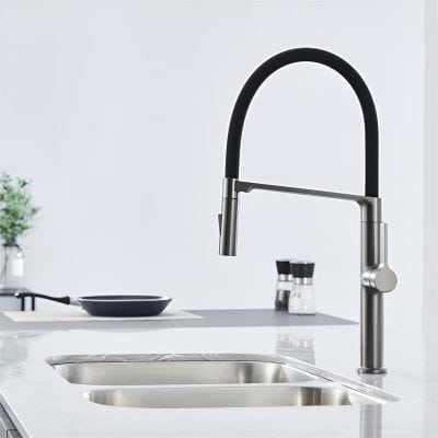 Modern kitchen sink with a sleek black and stainless steel faucet, minimalist design, ideal for contemporary kitchens, featuring easy-to-clean surfaces and stylish fixtures.