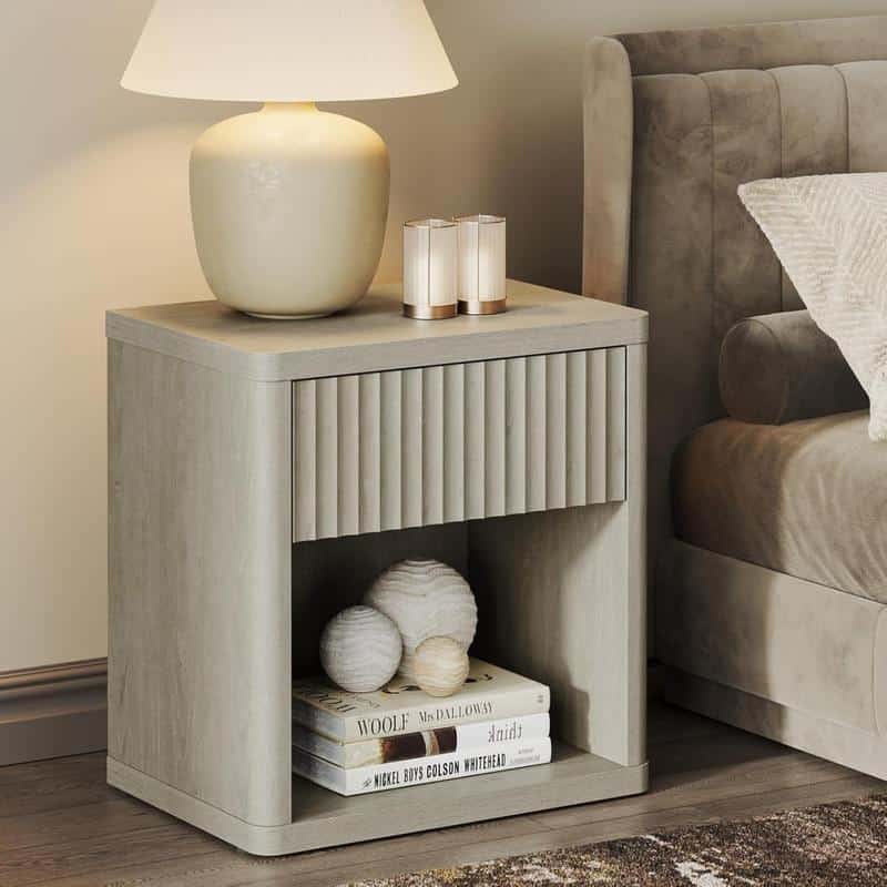 Miniature beige nightstand with vertical textured drawer front, beige table lamp, candles, decorative yarn balls, and books, modern bedroom decor, Monalisa Store opt.