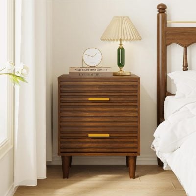 Mid-century modern wooden nightstand with slatted drawers and yellow handles in a cozy bedroom scene. Perfect for stylish bedroom storage and contemporary decor.