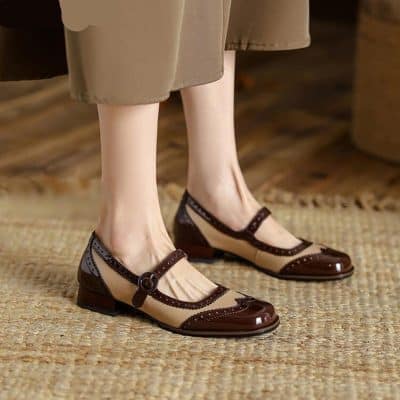 Elegant beige and brown women's dress shoes with strap detail, perfect for stylish occasions or office wear. Featuring a comfortable low heel and classic design.