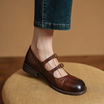 Brown leather vintage Mary Jane shoes with strap buckles, stylish footwear perfect for elegant occasions and daily wear from Monalisa Medical Store.