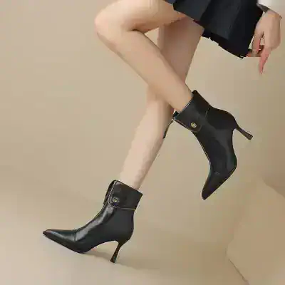 Black stylish high-heeled ankle boots with zipper detail, perfect for trendy fashion and everyday wear. Elegant footwear suitable for women seeking chic and comfortable shoes.