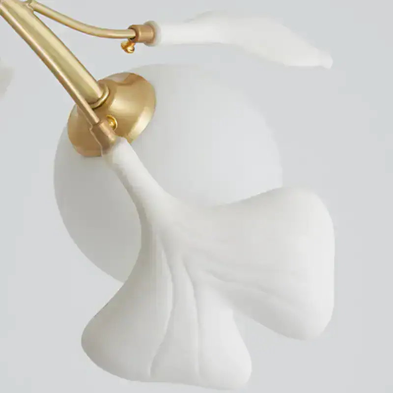 Gold and white faucet with flowing water for luxury bathroom decor.