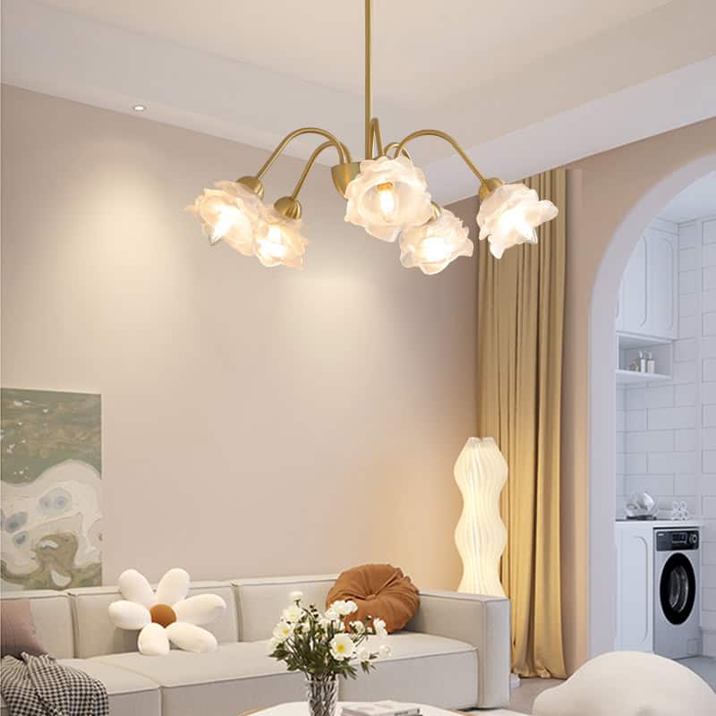 Chandelier with white flower-shaped lampshades in a modern living room with cozy sofa and floral decor, featuring elegant curtains and a stylish floor lamp, creating a chic, inviting atmosphere.