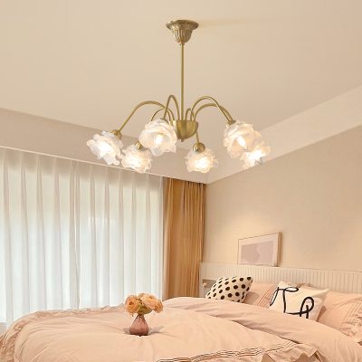 Elegant chandelier with floral glass shades in a cozy bedroom setting. Perfect for enhancing bedroom ambiance and style.