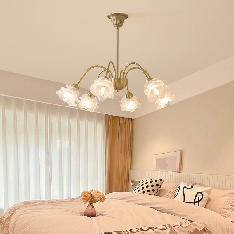 Elegant chandelier with floral glass shades in a cozy bedroom setting. Perfect for enhancing bedroom ambiance and style.
