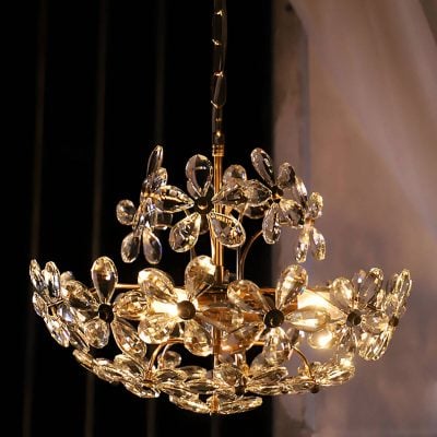 Elegant crystal chandelier with intricate flower design, luxurious lighting fixture perfect for upscale living spaces and interior decor.