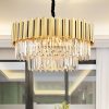 Elegant modern chandelier with crystal accents and gold finish, ideal for luxury interior decor in upscale homes and hotels.