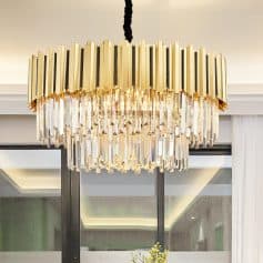 Elegant modern chandelier with crystal accents and gold finish, ideal for luxury interior decor in upscale homes and hotels.