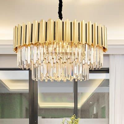 Elegant modern chandelier with crystal accents and gold finish, ideal for luxury interior decor in upscale homes and hotels.