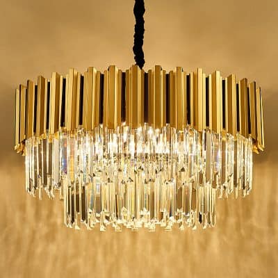 Golden and crystal chandelier, luxurious lighting fixture for upscale interiors, ideal for modern and elegant spaces. Perfect for enhancing the aesthetic of a high-end setting.