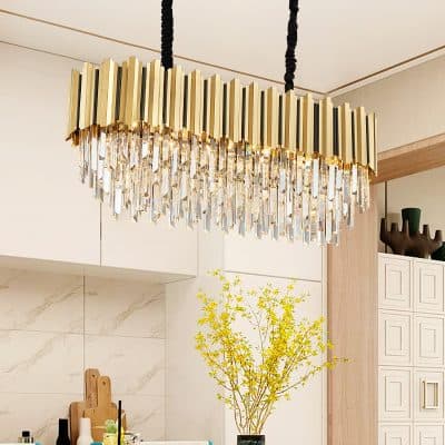 Elegant modern chandelier with gold accents and hanging crystal prisms in the Monalisa Store, creating a luxurious ambiance in the optician's showroom.