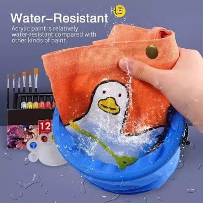 Water-resistant acrylic paint demonstrating durability on a colorful fabric item; ideal for painters and DIY enthusiasts.