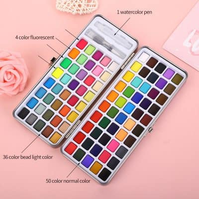 Watercolor nail art set with colorful paints and brushes for professional and at-home manicure decoration.