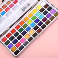 Vibrant watercolor paint set in a sleek metal case, perfect for professional and hobby artists. Features a wide range of bright and pastel colors for creative artistry and detailed work.,.