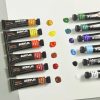 Vibrant acrylic paint tubes and color swatches from Monalisa Store, ideal for art and cosmetics projects, showcasing high-quality pigments for creative makeup and artistic applications.
