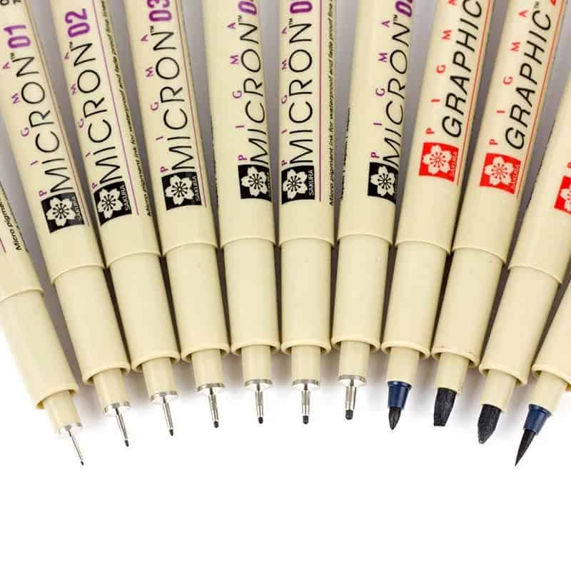 Bright white Micron black and colored ink pens displayed in a row, ideal for precise graphic design, illustration, and technical drawings at Monalisa Store.