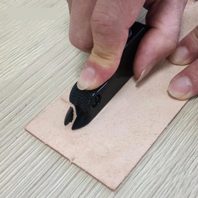 Precise leathercraft stitching tool in use, demonstrating professional craftsmanship for high-quality leather and fashion accessories at Monalisa Store.