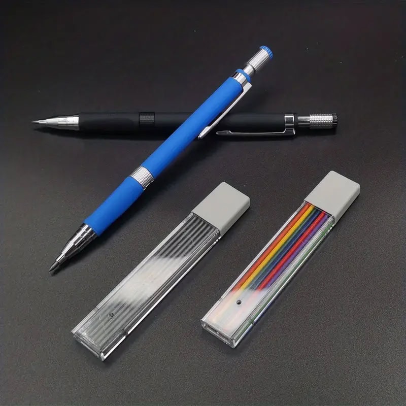 Blue and black retractable ballpoint pens with textured grips and metal clips on a black surface, alongside two transparent storage cases containing colorful stationery supplies, perfect for office or school use.