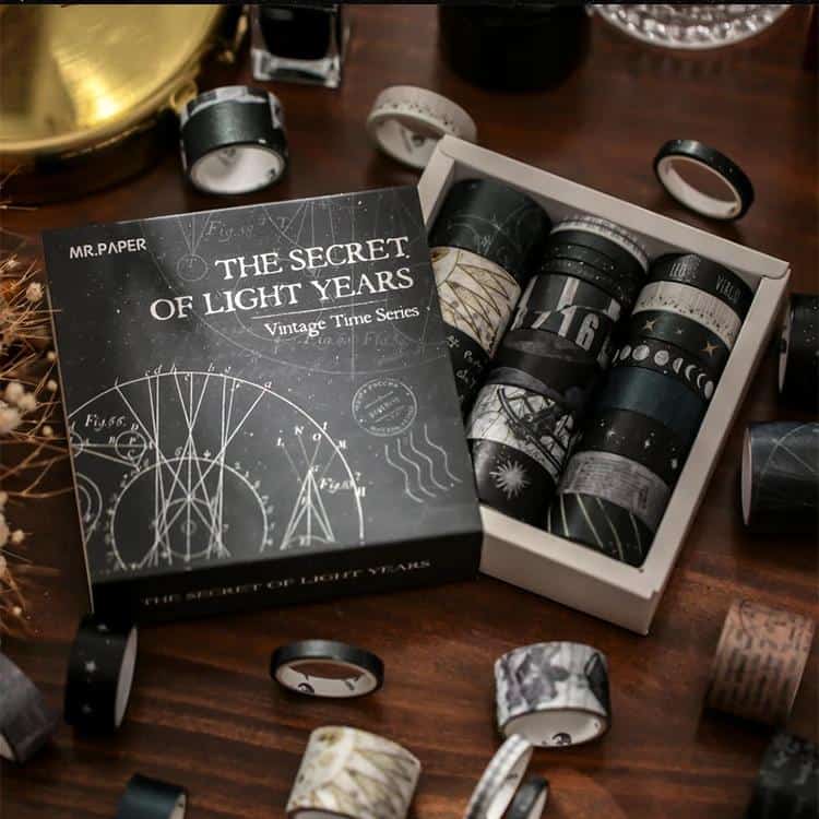 Black washi tapes with celestial and astronomy designs in a gift box at Monalisa Store for decorative craft projects.