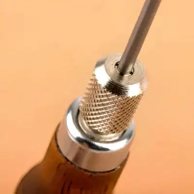 Precision dental drill handpiece used in dental care and restoration procedures.