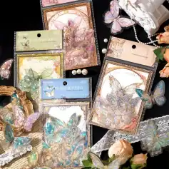 Butterfly-themed embellishments, holographic butterfly stickers and decorative cards from Monalisa Store, perfect for craft projects, stationery, or decorating with elegant, iridescent butterfly motifs.
