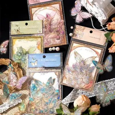 Butterfly-themed embellishments, holographic butterfly stickers and decorative cards from Monalisa Store, perfect for craft projects, stationery, or decorating with elegant, iridescent butterfly motifs.