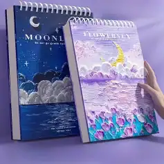 Dreamy moon and floral themed notebooks with artistic sky and ocean designs for aesthetic note-taking and journaling, perfect for art lovers and fans of celestial and nature-inspired visuals.