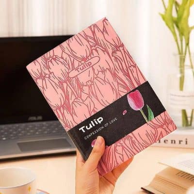 Vibrant pink tulip-themed gift box with black band featuring