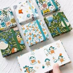 Miniature fabric notebooks with colorful, nature-inspired prints perfect for adult or children's journaling and note-taking. Small size makes them portable for daily use and creative projects.