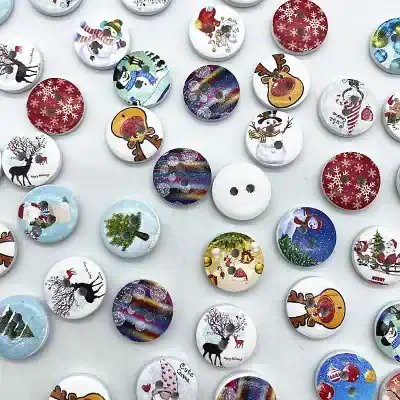 Christmas-themed decorative buttons with snowmen, reindeer, Santa, and festive patterns for holiday fashion and crafts.