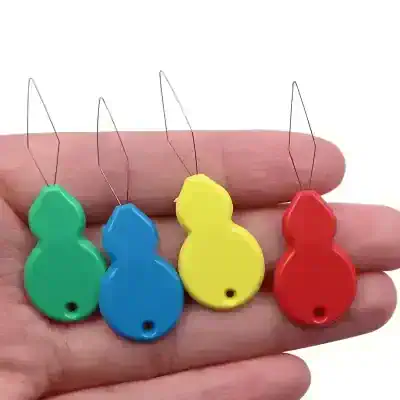 Colorful alarm tags with metal loops, used for eye health and vision safety monitoring in optometry practices. Perfect for optometrists to identify patients' eyewear or equipment.