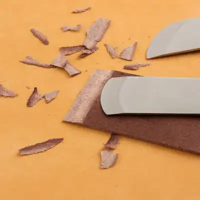 Shaving razors and brown craft paper on orange background, close-up, hair removal tools used for beauty treatment at Monalisa Store.