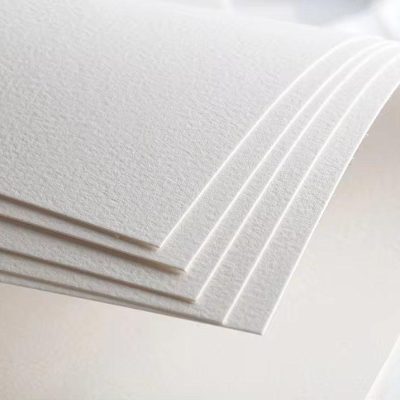 Smooth white textured paper sheets for optical use, high-quality printing or stationery, suitable for professional and personal projects.