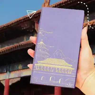 Elegant purple notebook with gold-foiled traditional Asian temple design, ideal for note-taking or journaling, perfect for travel or gift from Monalisa Store.