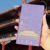 Elegant purple notebook with gold-embossed Chinese temple and mountain design, perfect for travel journaling or gifting. Ideal for those interested in Asian culture and scenic notebook covers.