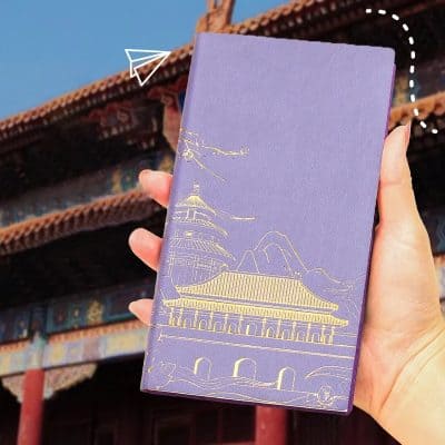 Elegant purple notebook with gold-embossed Chinese temple and mountain design, perfect for travel journaling or gifting. Ideal for those interested in Asian culture and scenic notebook covers.