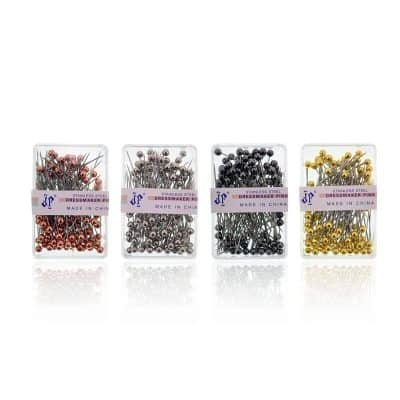 Colorful stainless steel dressmaker pins in red, silver, black, and gold, ideal for sewing and tailoring supplies.