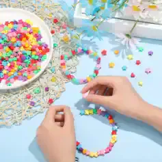 Colorful star-shaped bead jewelry-making supplies and hands assembling a bracelet, showcasing jewelry accessories for women at Monalisa Store.