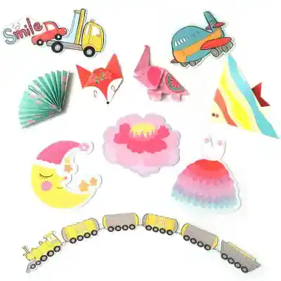 Colorful children's paper crafts including a smiling moon, paper train, airplanes, a rainbow fish, fox, elephant, and decorative flowers and clouds, ideal for kids' entertainment and educational activities.