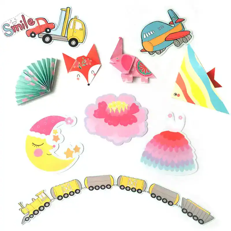 Colorful children's paper crafts including a smiling moon, paper train, airplanes, a rainbow fish, fox, elephant, and decorative flowers and clouds, ideal for kids' entertainment and educational activities.